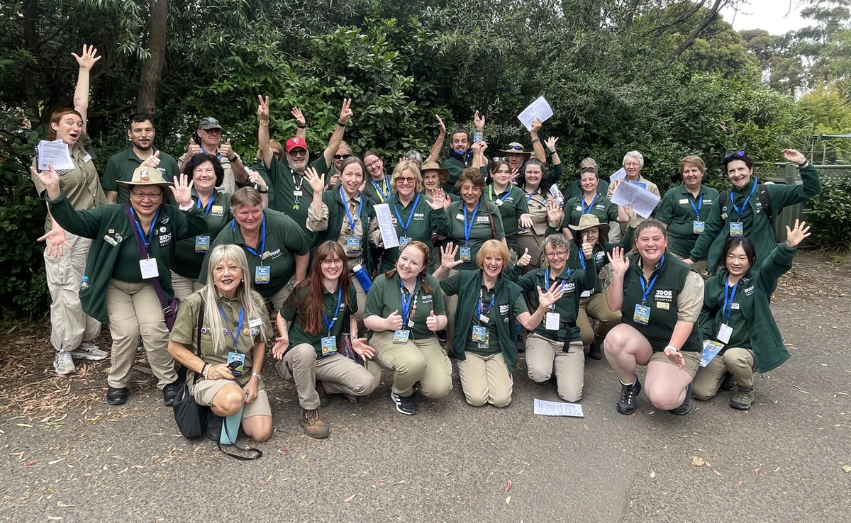 Group of volunteers smiling and cheerful at the camera