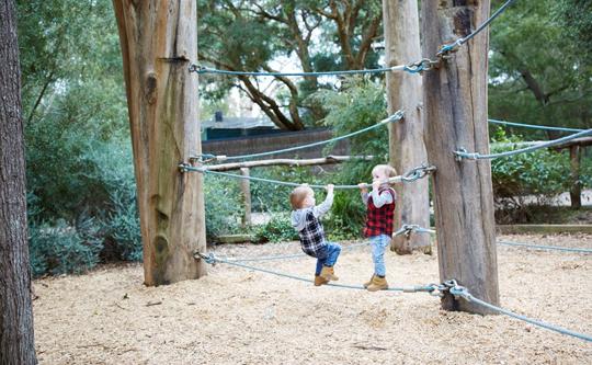 Two kids playing at Bunjil Nature Play